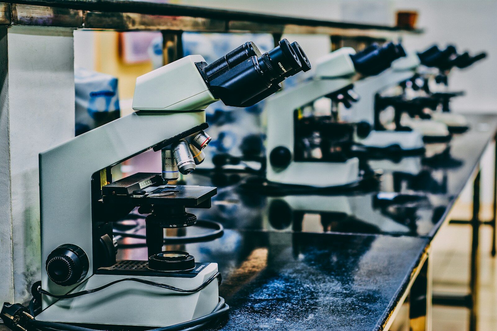 Photo by Ousa Chea white microscope on top of black table
